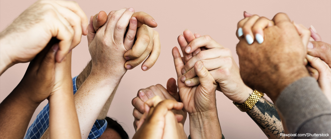 Group of individuals holding hands